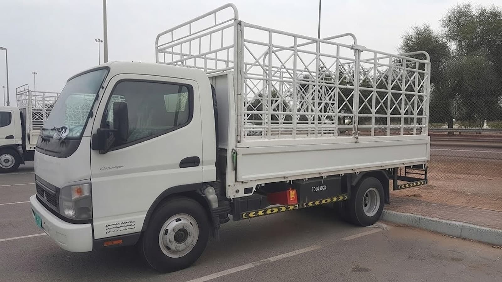 Al Qudrah Alhadidia flatbed pickup with a cargo frame